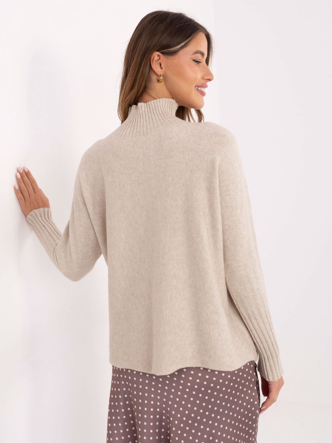 Light beige turtleneck sweater with long sleeves