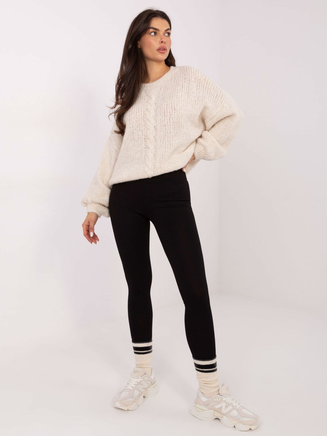 Beige sweater with round neckline and textured pattern