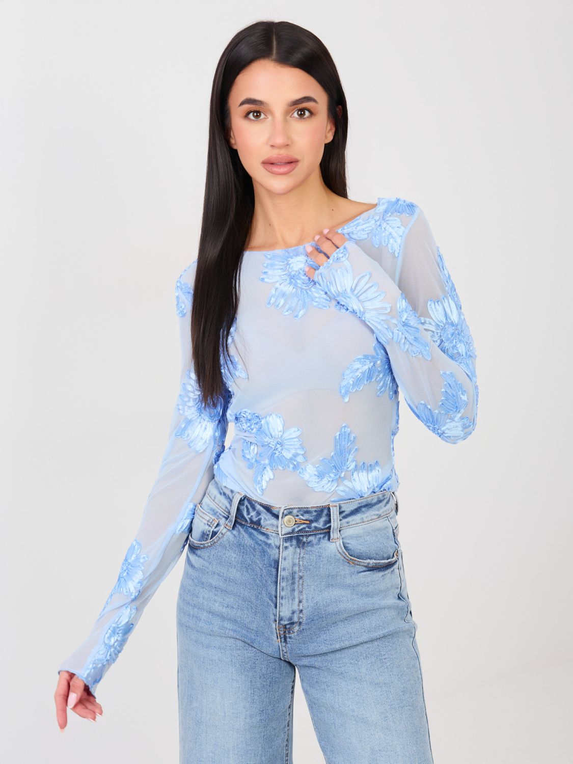 Elegant light blue blouse with floral appliqué and embroidery