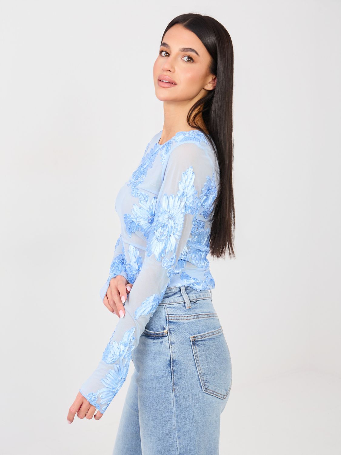 Elegant light blue blouse with floral appliqué and embroidery