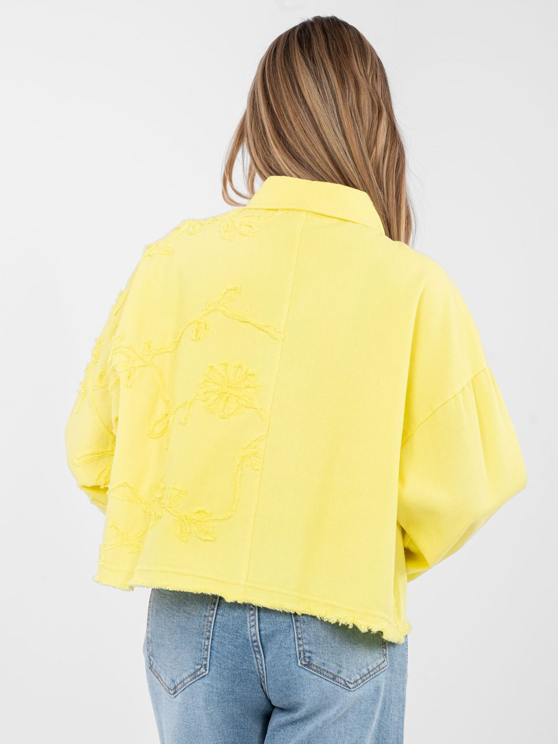 Short yellow denim jacket with floral appliqué