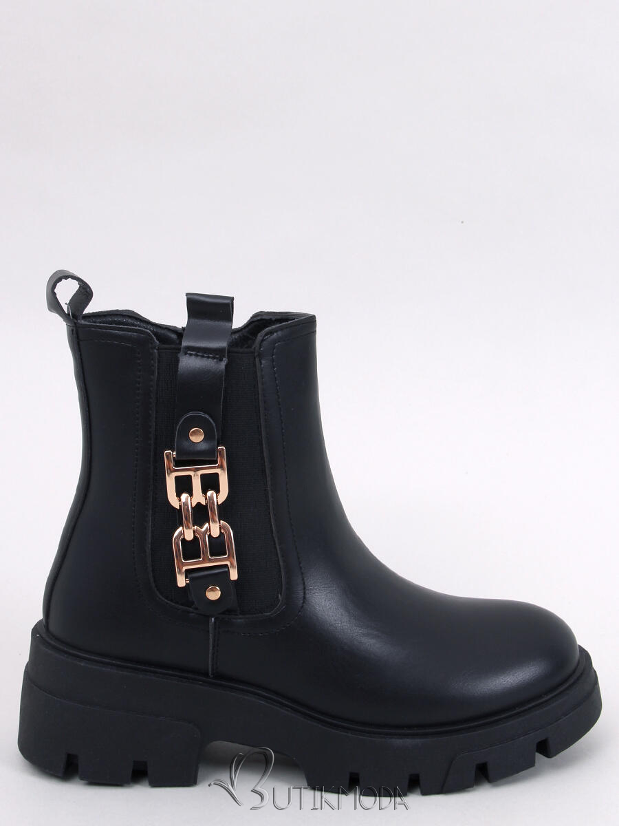 Black boots with gold buckle