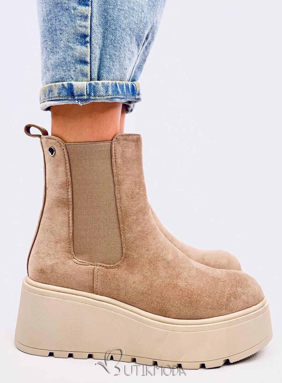 Beige chelsea boots on a high platform