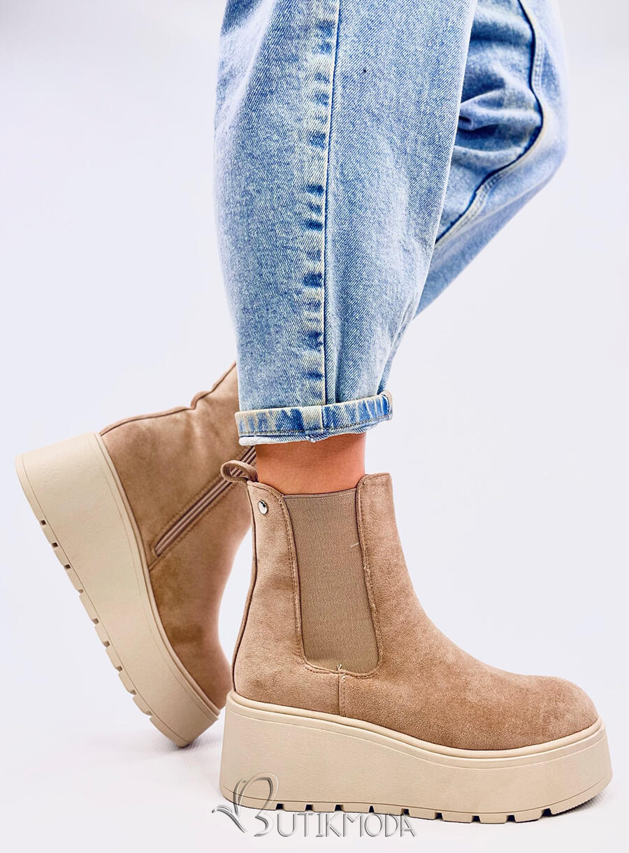 Beige chelsea boots on a high platform