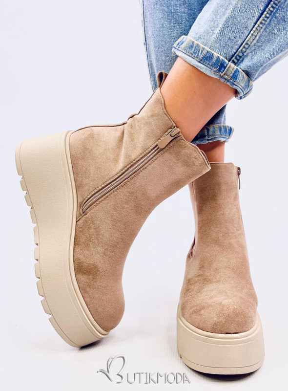 Beige chelsea boots on a high platform