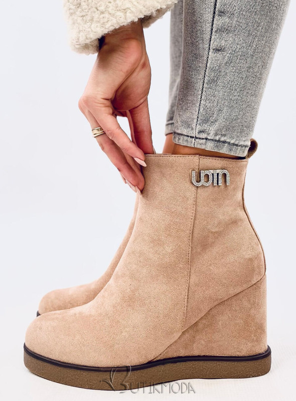 Beige ankle boots on a wedge heel