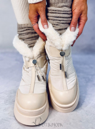 Beige snow shoes on a high platform