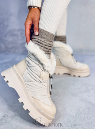 Beige snow shoes on a high platform