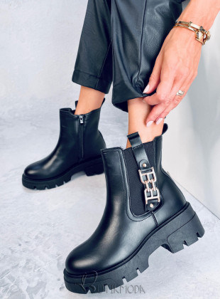Black boots with gold buckle