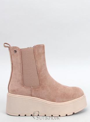 Beige chelsea boots on a high platform