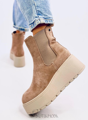 Beige chelsea boots on a high platform