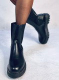 Black boots made of eco-leather on the platform