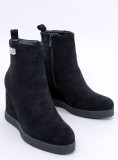 Black ankle boots on a wedge heel