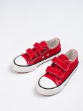 Red children's sneakers with velcro