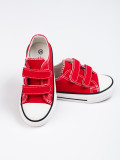 Red children's sneakers with velcro