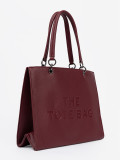 Burgundy tote bag with embossed lettering