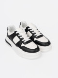 Stylish Black and White Sneakers with Thick Sole