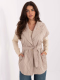 Beige quilted vest with belt and brooch
