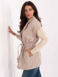 Beige quilted vest with belt and brooch