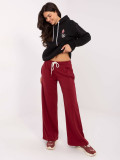 Burgundy sweatpants with wide legs