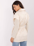 Elegant beige quilted vest with belt and brooch