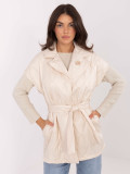 Elegant beige quilted vest with belt and brooch