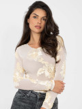 Elegant beige blouse with floral appliqué and embroidery