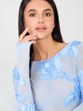 Elegant light blue blouse with floral appliqué and embroidery