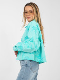 Turquoise women's denim jacket with floral appliqué